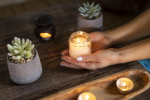 high-angle-woman-holding-candle